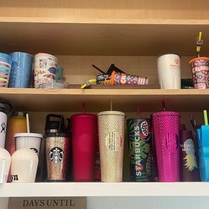 Selling Starbucks cups.